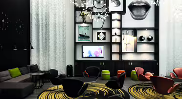 A modern lounge with black and white decor featuring a sectional sofa, stylish chairs around circular rugs, and a wall-mounted shelving unit displaying art, a bicycle, and decorative items. A screen and patterned light fixtures add to the contemporary vibe.